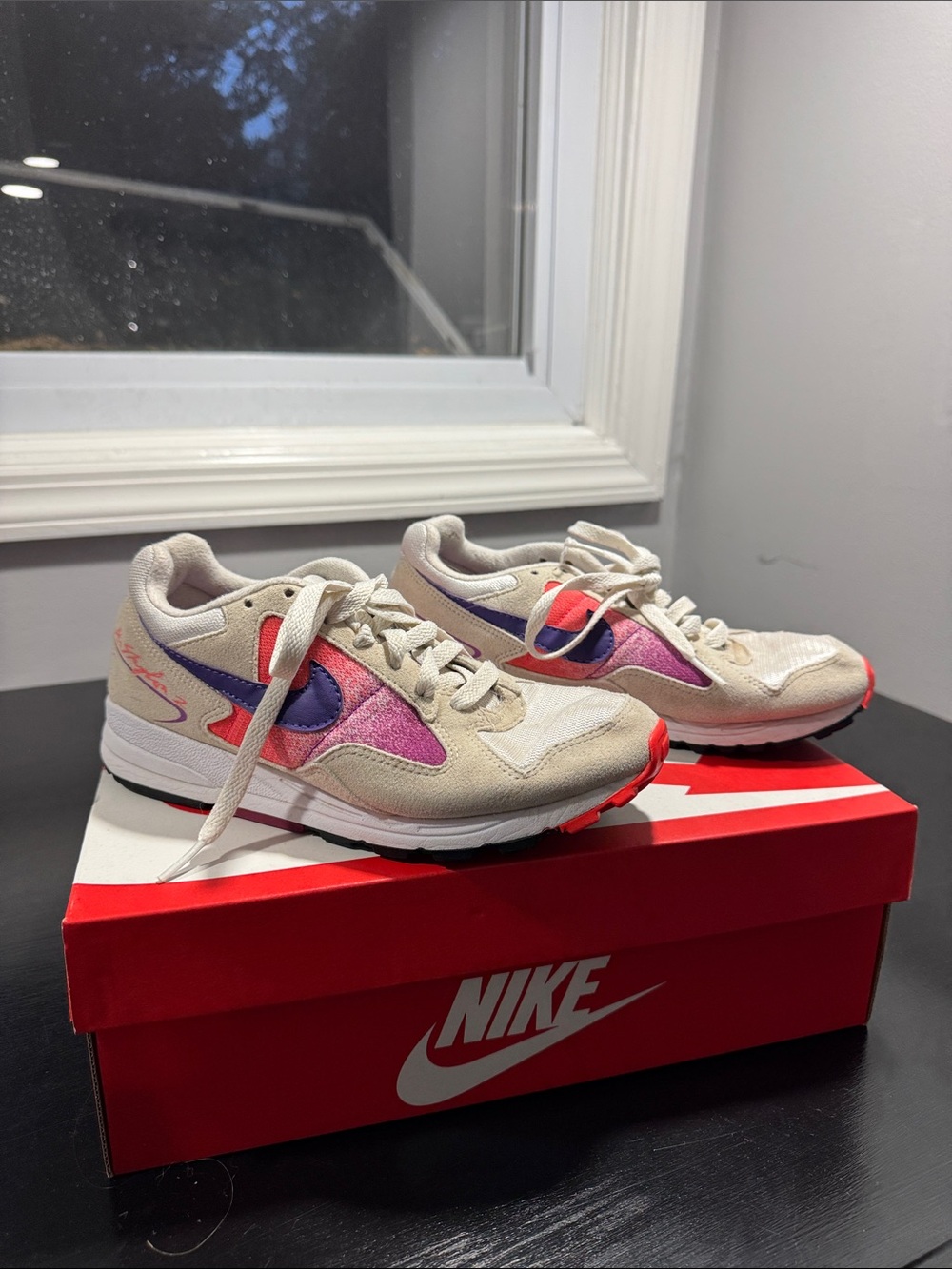 Nike Beige Sneakers with Pink and Purple Accents and Red Outsole